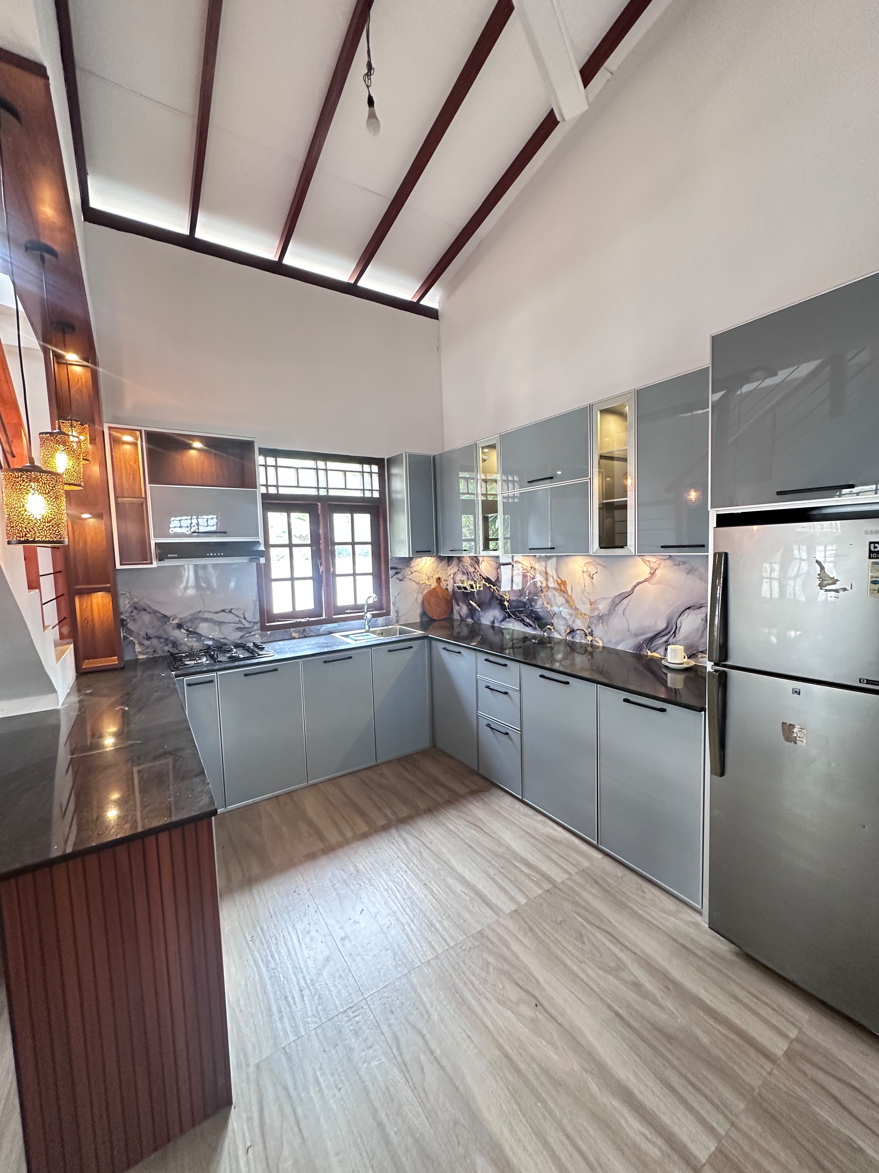 Modern grey aluminium kitchen with vaulted ceiling
